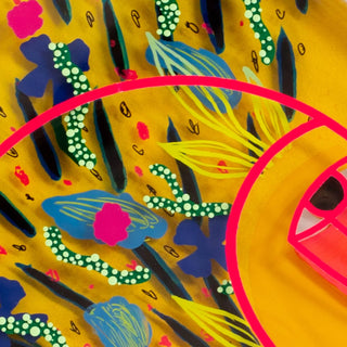 Colorful abstract design within a pink jen head on a yellow background