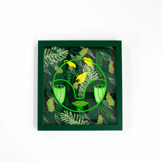 Framed artwork with green and yellow design on a white background