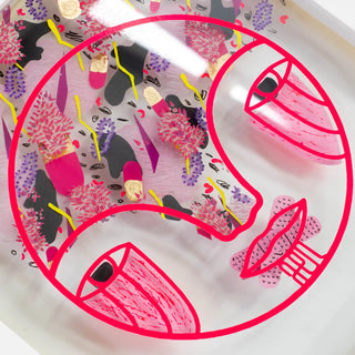Decorative plate with pink and black abstract designs on a white background